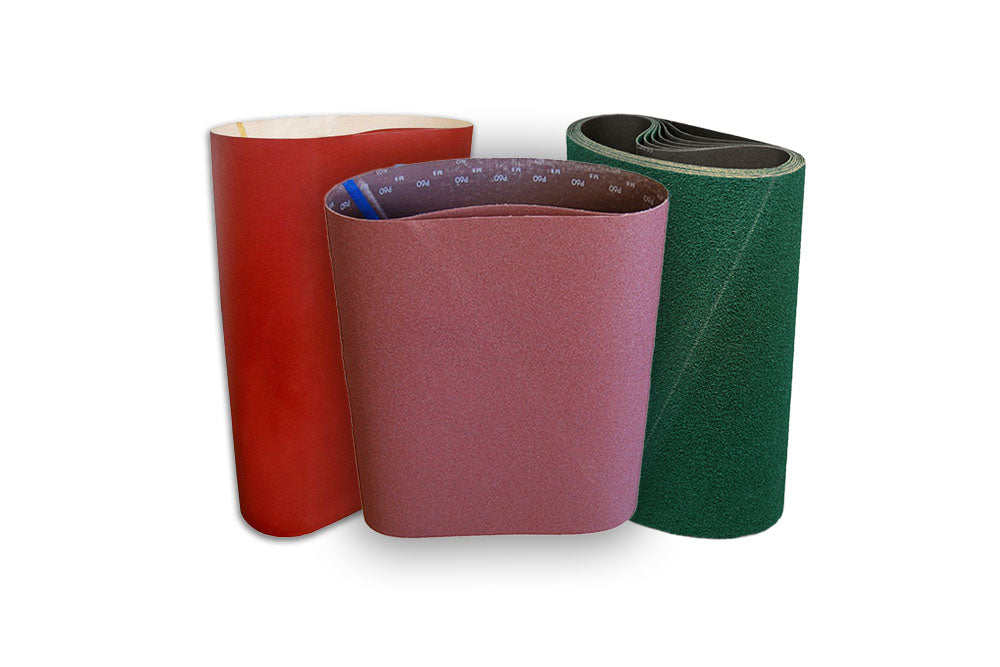 Red, purple and green rolls of abrasive floor sanding belt material