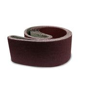 Pack of three 4x106 inch sanding belts in Aluminum Oxide, Silicon Carbide, and Zirconia for versatile surface sanding.